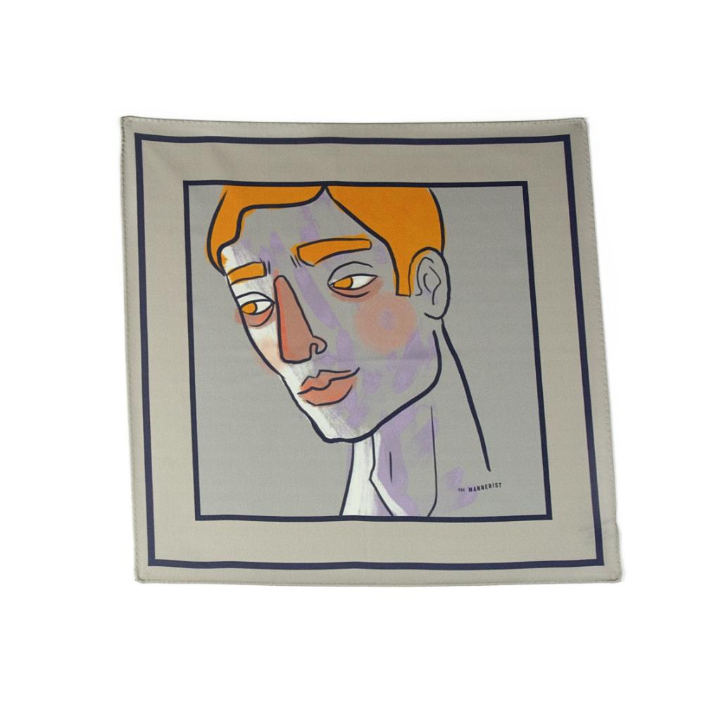 Grey silk pocket square with portrait design in yellow, black, white and hints of purple.